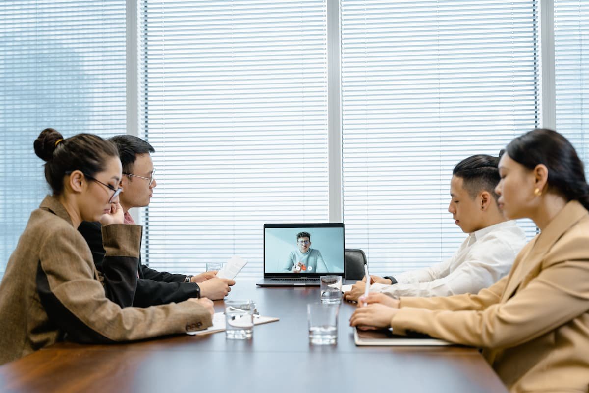 Global business team on a video call comparing offshore vs nearshore BPO models